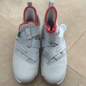 Nike Kids Gray Sneakers with Red and Gold Accents
